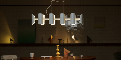 White heavy lamp hanging from grooved thick steel 
