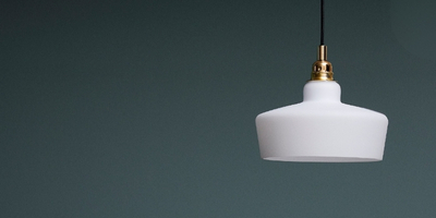 white pendant lamp on a blue wall